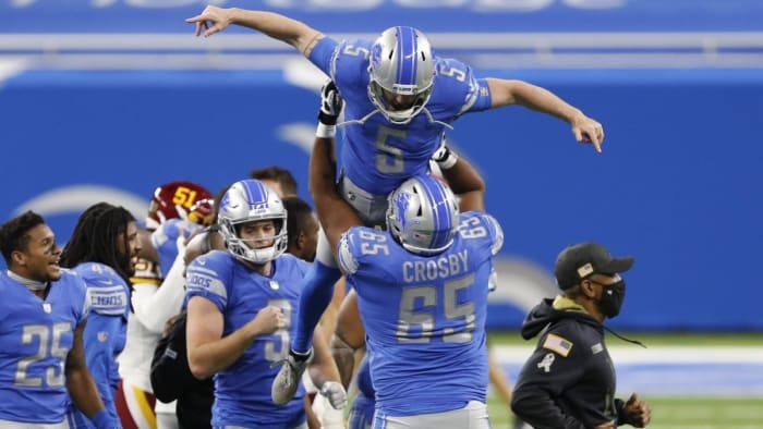 Ex-Lions kicker Matt Prater is lifted up in the air by Crosby, after making the game-winning field goal against the Washington Football Team.
